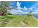 Lush backyard with direct water access and scenic views at 3376 Peace River Dr, Punta Gorda, FL 33983