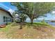 Spacious backyard with mature trees and direct water access at 3376 Peace River Dr, Punta Gorda, FL 33983