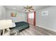 Guest bedroom with coastal decor, wood-look flooring, and closet at 3376 Peace River Dr, Punta Gorda, FL 33983