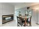 Cozy dining area with tile flooring and a fireplace creates a warm ambiance at 3376 Peace River Dr, Punta Gorda, FL 33983