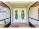 Inviting double front doors with tiled entryway and a 'Welcome' mat at 3376 Peace River Dr, Punta Gorda, FL 33983
