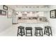 Kitchen with breakfast bar offers seamless flow and functionality at 3376 Peace River Dr, Punta Gorda, FL 33983