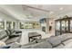 Spacious living room with tile floors, fireplace, and sliding glass doors leading to pool at 3376 Peace River Dr, Punta Gorda, FL 33983