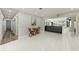 View of the open-concept living room with backyard views and tile flooring at 3376 Peace River Dr, Punta Gorda, FL 33983