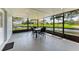 Screened patio with canal view, table and chairs at 3376 Peace River Dr, Punta Gorda, FL 33983