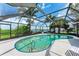 Inviting screened-in pool area with water views, perfect for outdoor relaxation at 3376 Peace River Dr, Punta Gorda, FL 33983