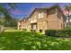Spacious backyard with lush green grass, offering plenty of room for outdoor activities at 3633 Parkridge Cir # 10-201, Sarasota, FL 34243
