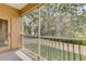 Screened balcony overlooking lush lawn, providing privacy and outdoor enjoyment at 3633 Parkridge Cir # 10-201, Sarasota, FL 34243