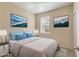 Comfortable bedroom with a soft bed, bedside tables, and natural light streaming in through the window at 3633 Parkridge Cir # 10-201, Sarasota, FL 34243