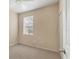 Neutral bedroom featuring a window and a ceiling fan at 3633 Parkridge Cir # 10-201, Sarasota, FL 34243