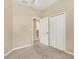 Bedroom features a closet and access to other rooms at 3633 Parkridge Cir # 10-201, Sarasota, FL 34243