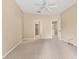 Carpeted bedroom with a ceiling fan and access to other rooms at 3633 Parkridge Cir # 10-201, Sarasota, FL 34243