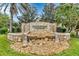 Stone monument sign for Parkridge Condominiums featuring a decorative rock garden at 3633 Parkridge Cir # 10-201, Sarasota, FL 34243