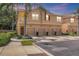 Charming townhome with a private garage and a cozy balcony surrounded by lush landscaping at 3633 Parkridge Cir # 10-201, Sarasota, FL 34243
