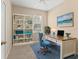 Inviting home office with a built-in bookcase, a stylish desk, and comfortable chair, fostering productivity at 3633 Parkridge Cir # 10-201, Sarasota, FL 34243