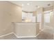 Bright kitchen with white cabinets, breakfast bar, and modern appliances at 3633 Parkridge Cir # 10-201, Sarasota, FL 34243