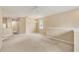 Spacious living room with neutral carpet, ceiling fan, and natural light at 3633 Parkridge Cir # 10-201, Sarasota, FL 34243