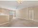 Spacious living room features neutral paint, carpet, and a ceiling fan at 3633 Parkridge Cir # 10-201, Sarasota, FL 34243