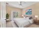 Cozy main bedroom with a plush bed, balcony access, and ample natural light, creating a serene retreat at 3633 Parkridge Cir # 10-201, Sarasota, FL 34243