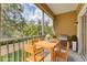 Relaxing screened patio with dining set and grill, ideal for outdoor gatherings and enjoying nature views at 3633 Parkridge Cir # 10-201, Sarasota, FL 34243