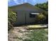 Backyard view with a kayak beside the home at 3661 Sterling Rd, Venice, FL 34293