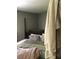 Bedroom with a queen bed and colorful bedding, highlighted by the neutral-colored walls at 3661 Sterling Rd, Venice, FL 34293