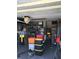 Cluttered garage with storage bins, shelves, and various items at 3661 Sterling Rd, Venice, FL 34293