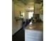 Kitchen featuring granite counters, stainless steel appliances, and ample white cabinetry at 3661 Sterling Rd, Venice, FL 34293