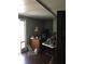 An unfinished bonus room with laminate floors, filled with potential for customization at 3661 Sterling Rd, Venice, FL 34293