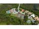 Aerial view of the community with mature trees, lush landscaping, and amenities at 4308 Via Del Santi, Venice, FL 34293