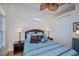 Bright bedroom features tile flooring, rattan furniture, and a ceiling fan at 4308 Via Del Santi, Venice, FL 34293