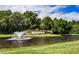 Beautiful entrance to Venetia community with lush landscaping and a tranquil water feature with fountain at 4308 Via Del Santi, Venice, FL 34293