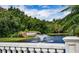 Scenic view of Venetia community entrance featuring a stone wall, water fountain and lush greenery at 4308 Via Del Santi, Venice, FL 34293