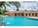 Exterior image of a large community pool and community building at 4308 Via Del Santi, Venice, FL 34293