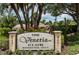 The Venetia Club community sign surrounded by tropical plants at 4308 Via Del Santi, Venice, FL 34293