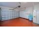 Clean garage with epoxy floor, white cabinets and room for storage at 4308 Via Del Santi, Venice, FL 34293