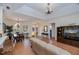 Open-concept living area with tile floors, neutral decor, and plenty of natural light at 4308 Via Del Santi, Venice, FL 34293