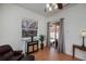 A bright room has a mirrored cabinet, a decorative lamp and sliding glass doors to the outside at 4308 Via Del Santi, Venice, FL 34293