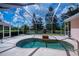 Sparkling pool with screened enclosure and scenic backyard views at 4308 Via Del Santi, Venice, FL 34293