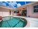 Beautiful outdoor pool with screened enclosure and relaxing patio area at 4308 Via Del Santi, Venice, FL 34293
