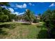 Exterior image of a screened lanai with lush landscaping at 4308 Via Del Santi, Venice, FL 34293