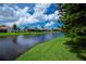 Scenic water view with several houses with screened in lanais at 4308 Via Del Santi, Venice, FL 34293