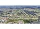 Extensive aerial view of a community featuring lush greenery and a variety of residential homes at 435 Boundary Blvd, Rotonda West, FL 33947