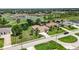 Scenic aerial view of a residential neighborhood with mature trees and well-maintained lawns at 435 Boundary Blvd, Rotonda West, FL 33947