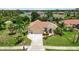 Aerial view of the property showcasing the home's layout, landscaping, and surrounding neighborhood at 435 Boundary Blvd, Rotonda West, FL 33947