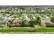 Attractive neighborhood boasting mature trees, well-kept homes, and lush green lawns at 435 Boundary Blvd, Rotonda West, FL 33947