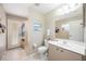 Bathroom with tiled shower, modern toilet, and ample counter space at 435 Boundary Blvd, Rotonda West, FL 33947