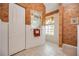 Bathroom featuring decorative mirror, tiled floors, and a window for natural light at 435 Boundary Blvd, Rotonda West, FL 33947