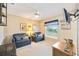 Cozy bedroom with comfortable seating, natural light, and ceiling fan at 435 Boundary Blvd, Rotonda West, FL 33947