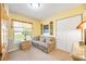 Bedroom featuring a comfortable sofa, window, and closet space for storage at 435 Boundary Blvd, Rotonda West, FL 33947
